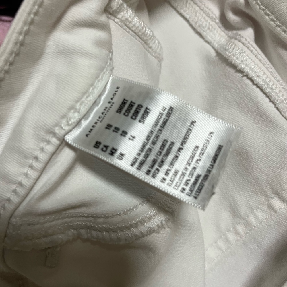 American Eagle White Jeans with holes.  Next level stretch.  Size 10
